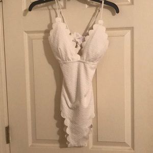 Lined white scalloped trim swimsuit.